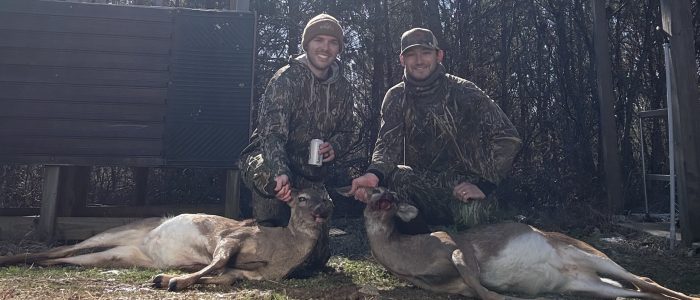 Hunters at Tom’s Creek Two hunters with their deer at Tom’s Creek Hunting Club